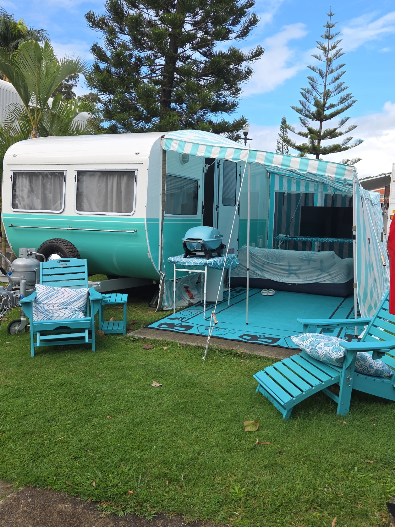 Retro turquoise caravan set up at a Gold Coast holiday park